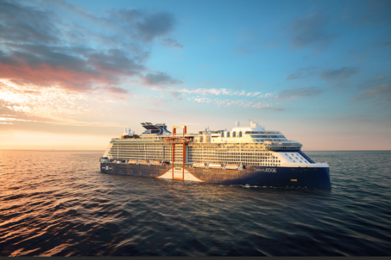 Celebrity Apex cruise ship sailing at sunset on the open ocean.